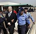 Fitzsimons is led away from an Iraqi court after escaping the death sentence