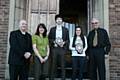 Grant and Samantha receiving their awards from Henry West MBE with principal Derek O’Toole and Yvonne Farrand  
