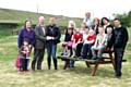 Councillor Evans presenting the cheque to Jane Barker, alongside his wife and granddaughter and children and staff at the home