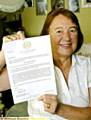 Jackie Duffy with the letter informing her about being awarded the Order of Mercy