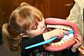 Toddler learning how to brush teeth properly 
