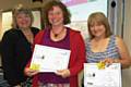 Lesley Mort, Deputy Managing Director presents Marie and Yvonne with their Going for Gold Stars award