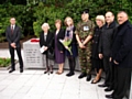 A wreath is laid on the new memorial 

