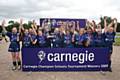 The girls pictured after winning the 2009 National Final.