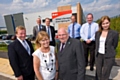 Oldham Councillor Bernard Judge, Rochdale Councillor Jacqui Beswick (front) and project partners visit the new street lighting depot on the Kingsway Business Park, where the project will be based.  
