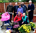 Nicole Fitton is pictured with members of The Co-operative Pharmacy’s senior team who have transformed her garden.
