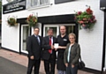 Chris, Manager at the Bridge Chippy receives their prize from Township in Bloom Steering Committee Chairman, Nigel Morell and Committee Members Peter Winkler and Kath Sharp