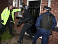 Police raids as part of investigation into burglaries (stock photo)