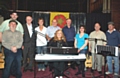 'Lanky Neet' line up: Vocalist Pat Fisher (keyboard) flanked by (left to right) Tony Bostock, Jamie Harrison (The band 'Gifted'), Roger Halstead, the Rev Sharon Jones, Peter Shrigley, Stuart Carmichael, Sheila Moore (all St Andrew's), Mike Fisher, Gareth Dickinson ('Gifted').

