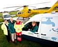 Lynda Brislin and Consultant Paramedic Mike Jackson, Chris Matthews from United Utilities
with UU employee looking on