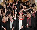 Hopwood Hall's Higher Education students celebrating on the steps of Rochdale Town Hall