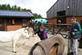 Key Productions director, John O’Hara, on camera and media production student Adam Sykes, 18, from Oldham (right) with the donkeys at Penny Farm in Blackpool.
