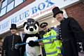 Retired police officers Mike McCulloch ( left) and  Tom Hughes (right) who are both retired GMP officers that volunteer to show groups around GMP Museum at the official opening of The Blue Box in Rochdale town centre with GMP mascot Pippa the Panda and Chief Inspector Nadeem Mir