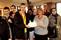 The group of students with the cake