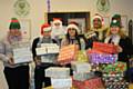 RBH employee members helping to pack the shoebox gifts