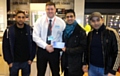 Aspire Generations Group members receiving their voucher from Jamie Balde, store manager of Argos.