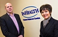 Mark Stanton, IT Director for InHealth  with Julie Evans, Business Development Manager at Rochdale Development Agency 