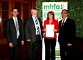 Tricia Hornby CEO of Rochdale & District Mind collecting the MHFA champions award from Simon Western OBE, Professor Lord Patel OBE & Nigel Jones, Partner and Co-Head of Healthcare sector Linklaters  LLP 
