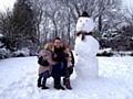 Ross Cunningham with Ruby, 3 and Skye, 6, and their snowman in Bamford