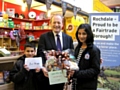 Simon Danczuk, presenting the first prize, a hamper of Fairtrade goods, to Urooj Azmat, and a Fairtrade voucher to Zain Malik