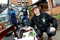 Antonio Franchini and Adam Smith are shown how to create a flowering hanging basket by Rikki Holroyd 
