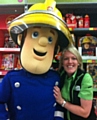 Asda employee Nicola Smith (pictured with Fireman Sam) will carry the Olympic Torch in Lancaster