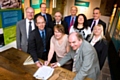 Representatives from Rochdale Borough Council, RBH and the Tenants’ Panel sign the transfer agreement at the Toad Lane Pioneers Museum in Rochdale