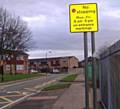 NO PARKING… road markings outside a school

