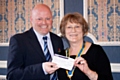 Bobby Denning of Lancashire Cricket Board presented with a cheque by Rochdale Rotary Club President Joan Banks