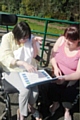 Donna Duffy uses her letter board with Danielle Turner, Honresfeld’s volunteer coordinator 