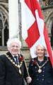 The Mayor, Councillor Alan Godson, and Mayoress, Gillian Brown, with the flag of St George outside Rochdale Town Hall