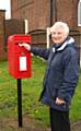 Cllr Pat Colclough next to the Post Box in Hartley Lane 