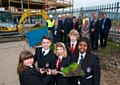 Pupils are joined by teachers, contractors and the Building Schools for the Future team to mark the transformation works that are underway
