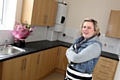 Danuta Mut in the kitchen of her new home