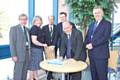 Health and Social Care leaders sign the Statement of Intent for the future of Rochdale Infirmary<br />John Jesky, Lesley Mort, Councillor Colin Lambert, John Archer, Dr Chris Duffy (signing the statement) and John Saxby