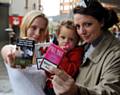 Local mum Jolene Jenkinson (left) with daughter Lucie (centre) from Rochdale pledges to help future generations by supporting plain cigarette packaging with the help of a member of the plain packaging engagement team Kimberley (right)