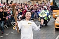 Wensheng Li aarives in Rochdale Town Centre with the Olympic Torch