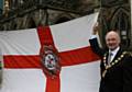 The Mayor of the Borough of Rochdale, Councillor James Gartside, prepares to raise the flag by Rochdale Town Hall
