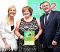 Gillian Fogarty receives the Nurse of the year award from Fiona Phillips and Mark Thomas of Vinci Construction UK Ltd