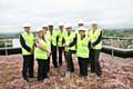 Trust Chairman John Jesky with hospital staff and senior managers from Vinci Construction UK on the roof top