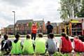 Nathan Milner (in red) and his mentor, skateboarder Neil Danns, giving an introduction to the fire safety workshop
