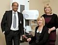 Mr Mohammed Shamim Absar, Clare Brearley, Macmillan advanced nurse practitioner and lead nurse for breast services, and Imelda Hughes (seated), pictured above with a mammogram machine