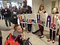 Adam Kutereba is greeted by family and friends on his return from America