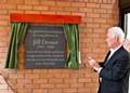 Mr Desser unveils a plaque at the opening of the newly refurbished courtyard area at the Floyd Unit at Birch Hill