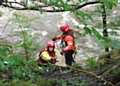 Firefighters from Heywood Fire Station help rescue the man in trouble on the River Irwell