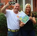 Wayne Butterworth and Lisa Smythe with the trophy and certificate