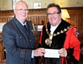 Wing Commander David Forbes presents the Mayor Councillor Peter Rush with a cheque for £500 towards the Mayor’s Charity 