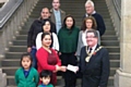 Mayor Peter Rush presents a cheque for £1,850