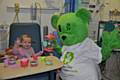 Ella enjoying a tea party with charity mascot, Humphrey