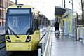 The first tram at the Metrolink stop in Shaw on the Rochdale to Oldham line